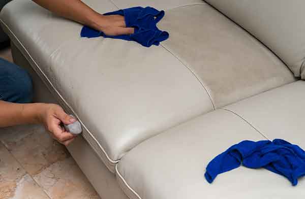 Leather Upholstery cleaning is being done by a professional cleaner.